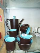 A Myott coffee set in matt chocolate brown having bright blue interior;