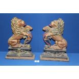 A pair of painted Cast Iron opposing rampant Lions, 14 1/2'' tall.