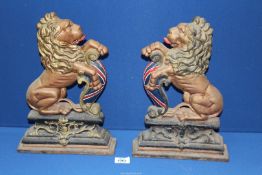 A pair of painted Cast Iron opposing rampant Lions, 14 1/2'' tall.