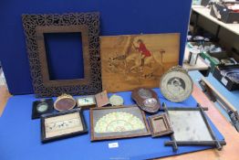 A quantity of frames including circular, cross framed mirror, hunting scene on wooden board,