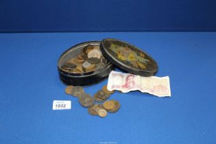 A metal tin of assorted coins including sixpences, Victorian coins and a 100 Greek note.