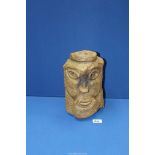 A heavy modernist carved stone head, 10 3/4" high.