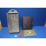 An empty embossed leather Victorian photo album together with an empty Persian lacquered photo