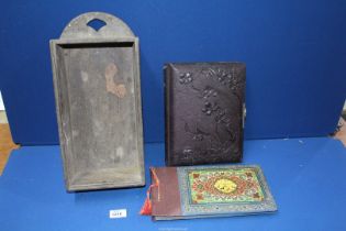 An empty embossed leather Victorian photo album together with an empty Persian lacquered photo