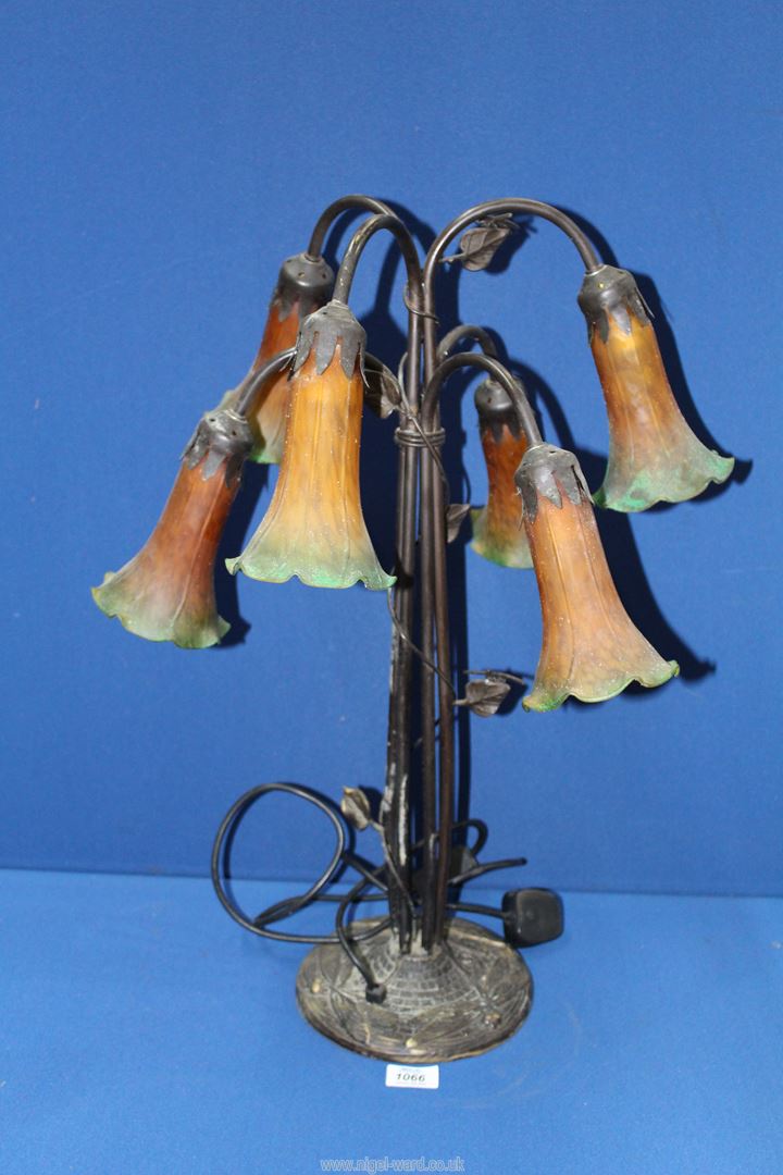 A six branch Lily type table Lamp with cast metal dragonfly base with orange/green shades,