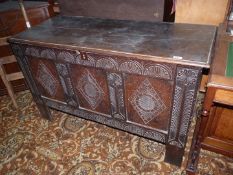 A three panel Oak Blanket Chest/Coffer having carved decoration to the front,