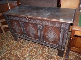 A three panel Oak Blanket Chest/Coffer having carved decoration to the front,