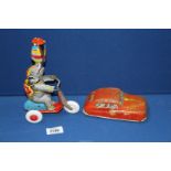 A clockwork Elephant on a Tricycle [West German] and a tin plate Fire Department car made in