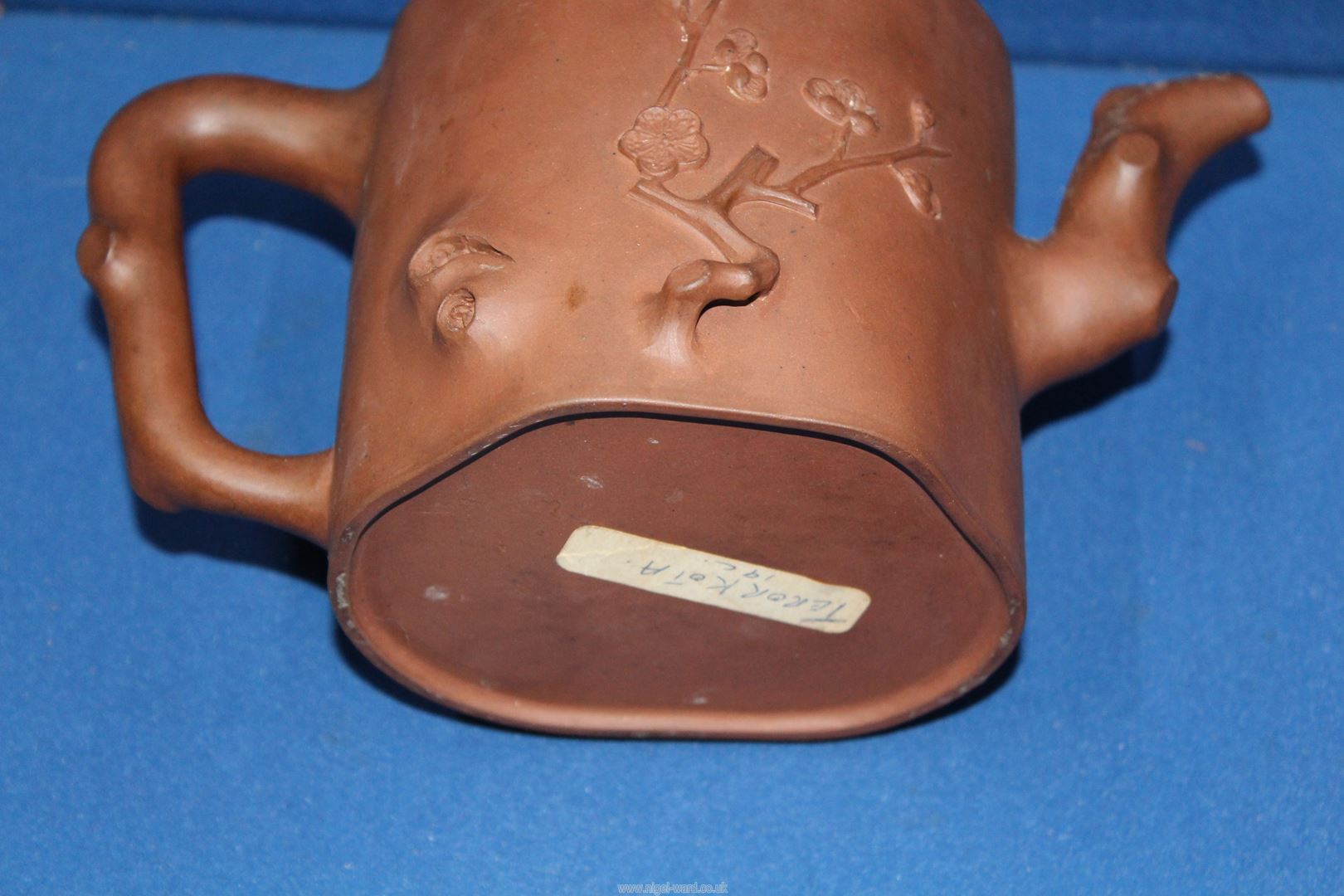 A Chinese terracotta Teapot having blossom relief, 5 1/2'' tall, lid chipped. - Image 5 of 6