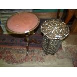 A small octagonal table inlaid with mother of pearl, some damage, 12 1/4" wide x 16 1/4" high.