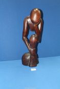 A carved African figure, 18 1/2" tall.