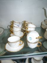 A set of twelve Sarreguemines crown and shield mark coffee cups and saucers,