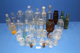 A quantity of old bottles and jars.