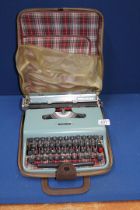 A vintage Olivetti Lettera 22 portable Typewriter in carry case.