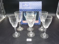 A boxed set of six crystal D'Ariana wine glasses.
