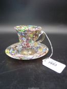 A very pretty Millefleur footed cup and saucer with sharp pontil to the base of the cup.