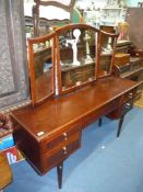 A Meredew Satinwood dressing Table having a frieze drawer and flanked by a pair of five drawers to