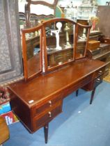 A Meredew Satinwood dressing Table having a frieze drawer and flanked by a pair of five drawers to