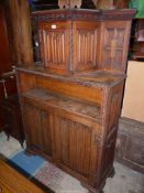 An unusual Oak linen-fold sideboard in the style of a Duodarn,