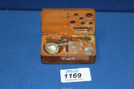 A cased set of Jewelers scales with weights, complete.