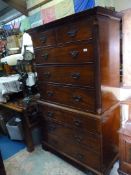 A Mahogany Chest on Chest having a dentil frieze fluted corners to the upper section,
