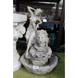 A composite Water feature with nymph and lion head detail, 19 1/2" tall.