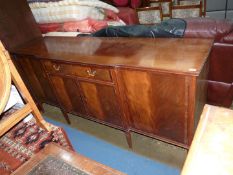 A Waring & Gillow Mahogany break front Sideboard having cross-banded detailing to the frieze drawer