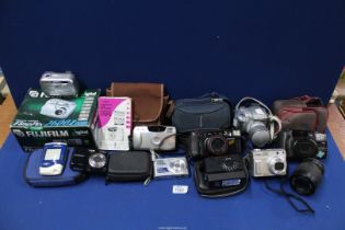 A box of cameras to include; FujiFilm, Panasonic, Sony, Pentax, Canon, etc.