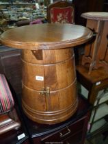 An unusual circular Oak Cabinet in the form of a capstan/early milk churn shape,