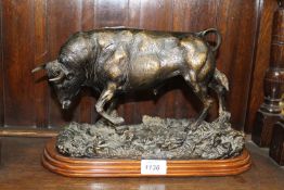 A heavy composite model of a Bull on plinth, 13 1/2" x 9".