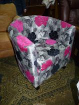 A stylish now backed/D-shaped Armchair stylishly upholstered in grey ground pale grey,