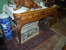 A mixed woods side/centre Table of good quality standing on canted cabriole legs with intricate