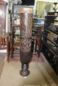 A Tribal Kuba cylindrical Drum on a pedestal base, stitched animal hide skin,