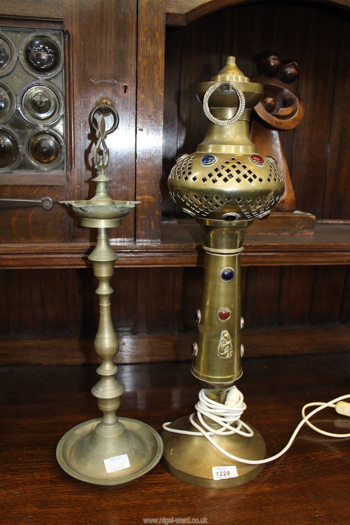 An Indian metal lamp base with inset polished stones converted for electric 25" tall and a metal