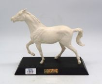 A 'Spirit of fire' Beswick white horse in matt finish on black plinth 10 1/2" wide x 9 1/4" high.