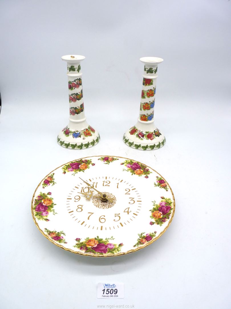 A pair of Portmeirion Pomana candlesticks,