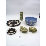 A Wedgwood black Jasper ware plate 9 1/2" diameter, a similar ashtray, two sage green shaped boxes,