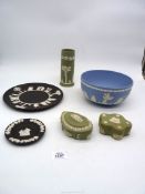 A Wedgwood black Jasper ware plate 9 1/2" diameter, a similar ashtray, two sage green shaped boxes,