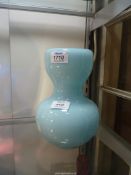 A vintage gourd shaped heavy Glass vase having inverted rim, light blue, 8" tall, 6" wide.
