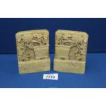 A pair of 19th c soapstone carving of flowers tumbling from a vale.