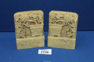 A pair of 19th c soapstone carving of flowers tumbling from a vale.