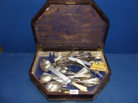 A darkwood cutlery box and contents of miscellaneous plated cutlery including ladle, knives, forks,