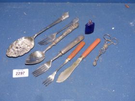 A small quantity of cutlery including nickel berry spoon, plated sugar tongs, ornate handled spoon,