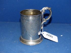 A Silver Christening mug engraved with initials, P.A.T.