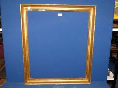 A gilt coloured picture frame with beading design, aperture size 21" x 25 1/2",