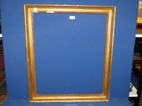 A gilt coloured picture frame with beading design, aperture size 21" x 25 1/2",