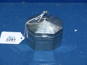A small eight sided silver Tea caddy, Chester 1930, 3" wide x 3 1/2" tall including handle, 102g.