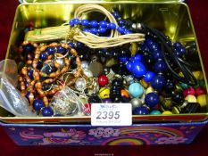 A quantity of beaded costume jewellery including necklaces, wooden bead bracelet, etc.