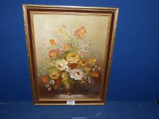 An Oil on canvas depicting a still life of flowers signed lower right Tranly, 14'' x 18''.