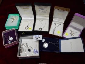 A quantity of contemporary chains and pendants, some 925 silver, including; floral pendants, etc.
